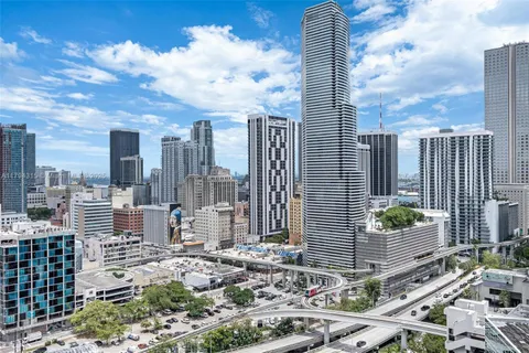 a view of a hallway with washer and dryer