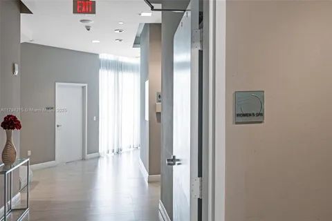 a view of a living room with gym equipment