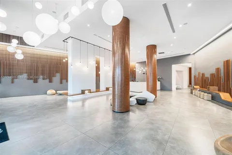 a view of a bathroom with a tub and mirror