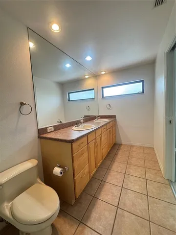a bathroom with a sink a mirror and a shower