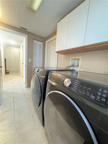 a bed sitting in a room next to a window