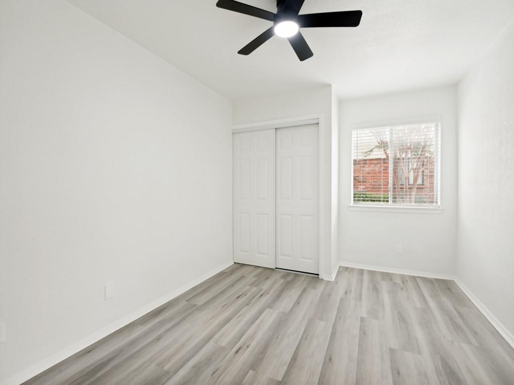 2240 Tarpley Road, Unit 92 Carrollton, TX 75006 - Photo 12 of 22 an empty room with a window and a ceiling fan