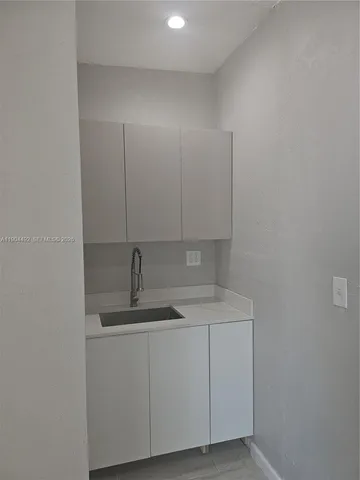 a bathroom with a sink and vanity
