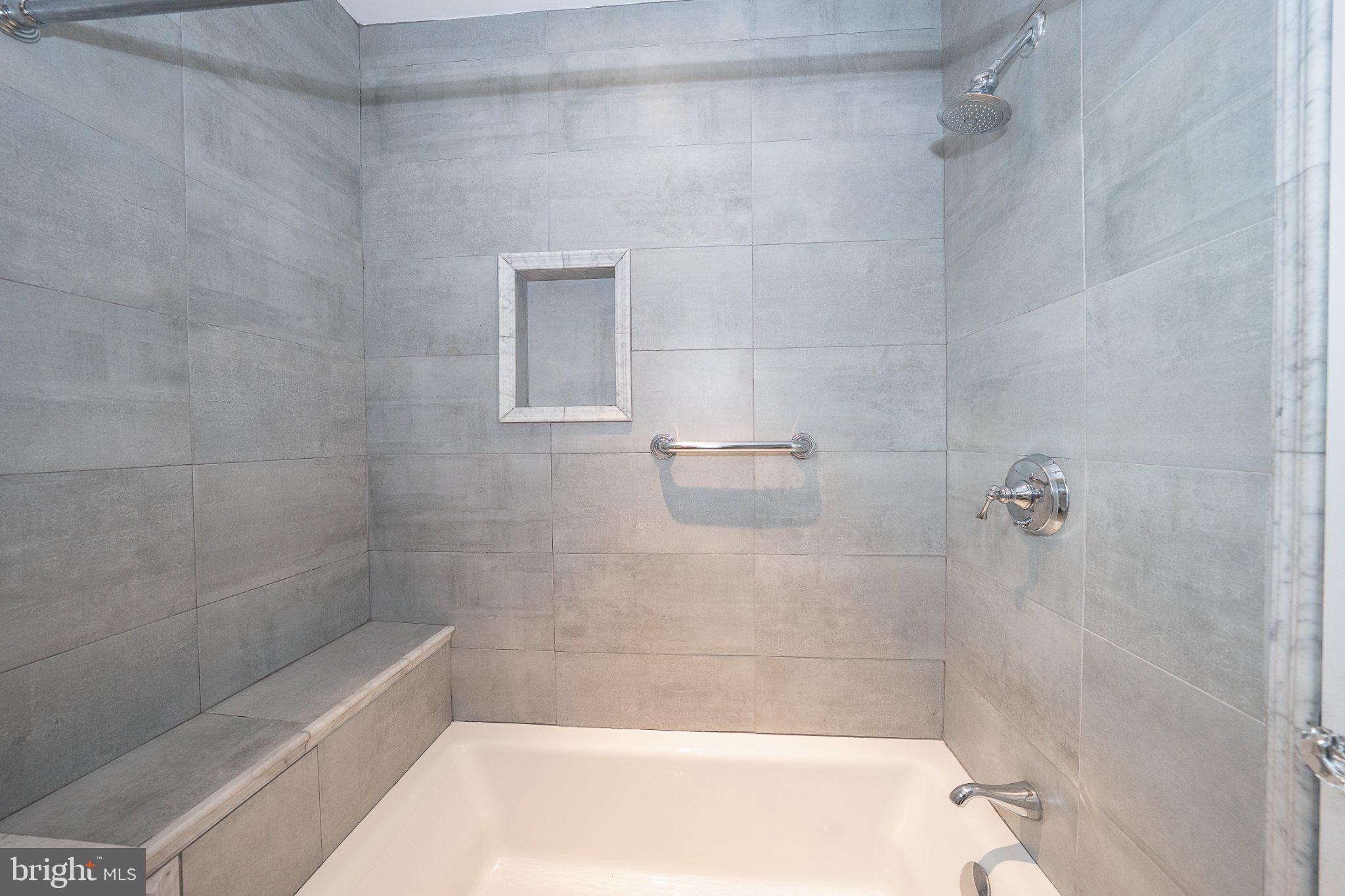 17 Gevrey, Unit 17 Devon, PA 19333 - Photo 25 of 33 Shower over full soaking tub with bath shelf