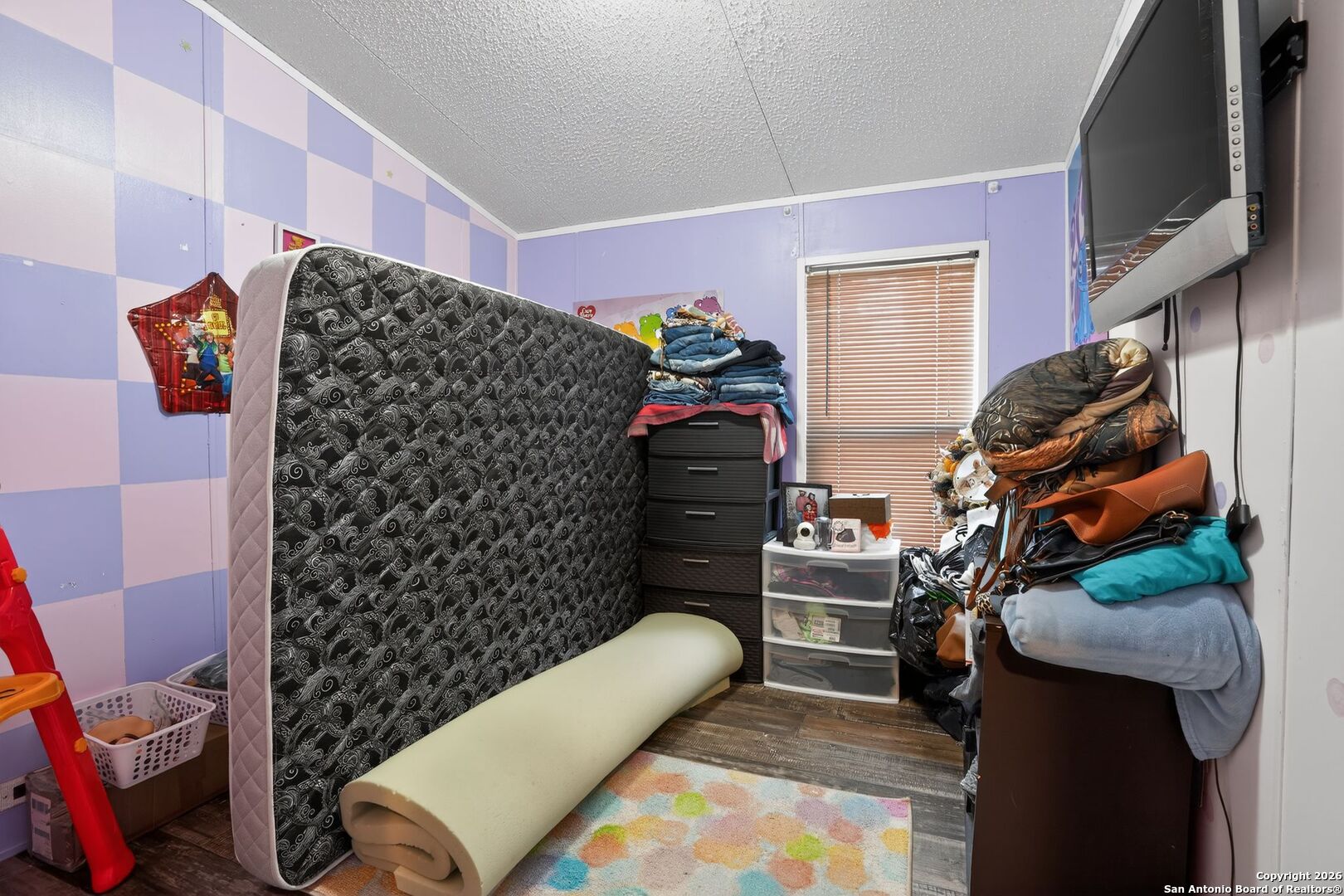 110 Old Street Seguin, TX 78155 - Photo 12 of 27 a view of walk in closet with clothes and shoes