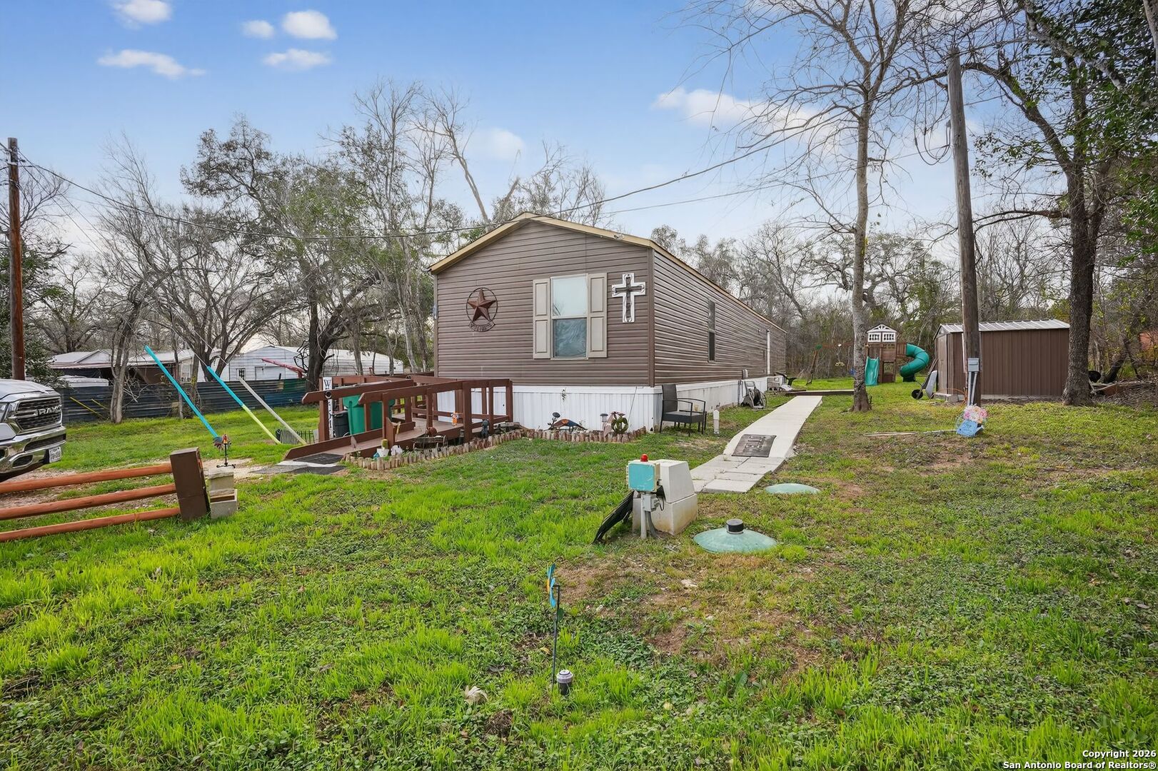 110 Old Street Seguin, TX 78155 - Photo 21 of 27 a view of a house with a yard patio and fire pit