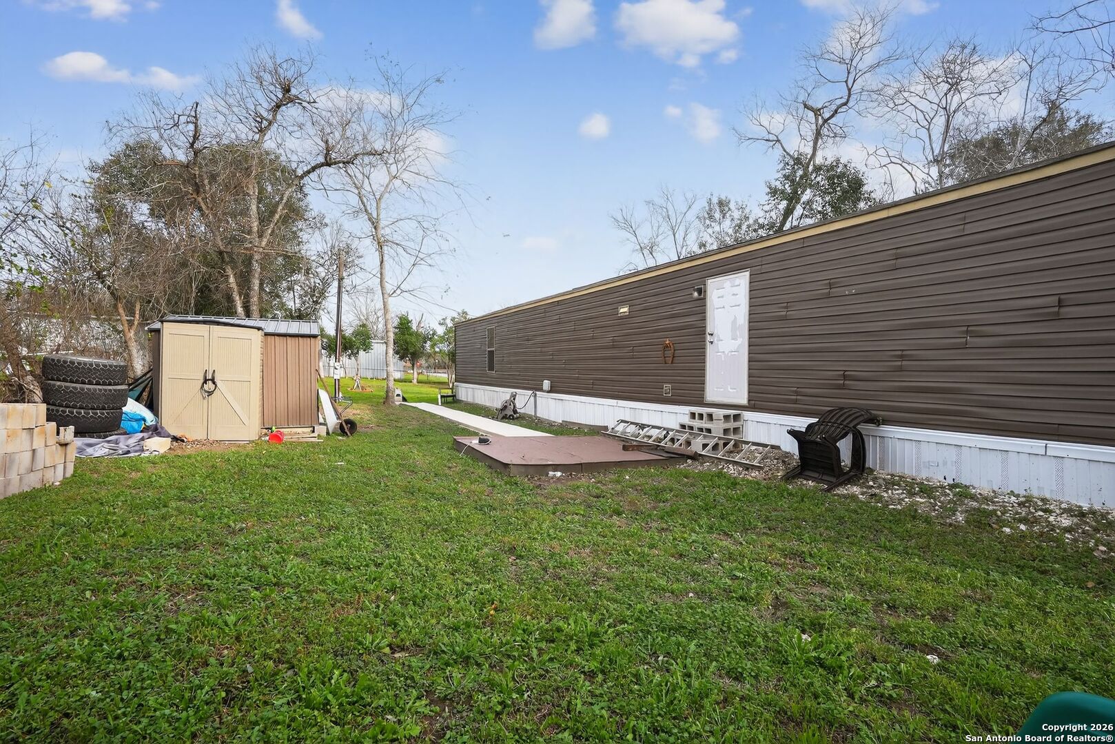 110 Old Street Seguin, TX 78155 - Photo 26 of 27 a view of a backyard with potted plants and large tree