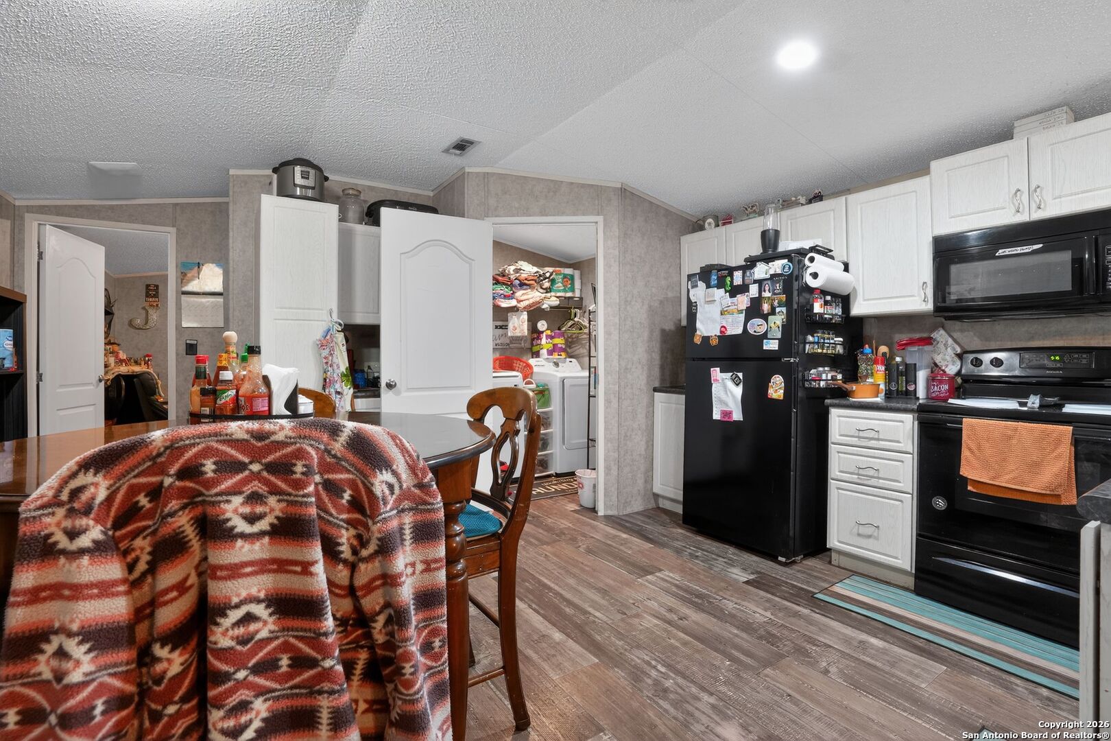 110 Old Street Seguin, TX 78155 - Photo 8 of 27 a view of a dining room with furniture and wooden floor