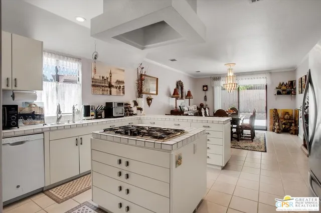 a kitchen with cabinets and window