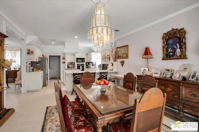 a dining room with furniture and window