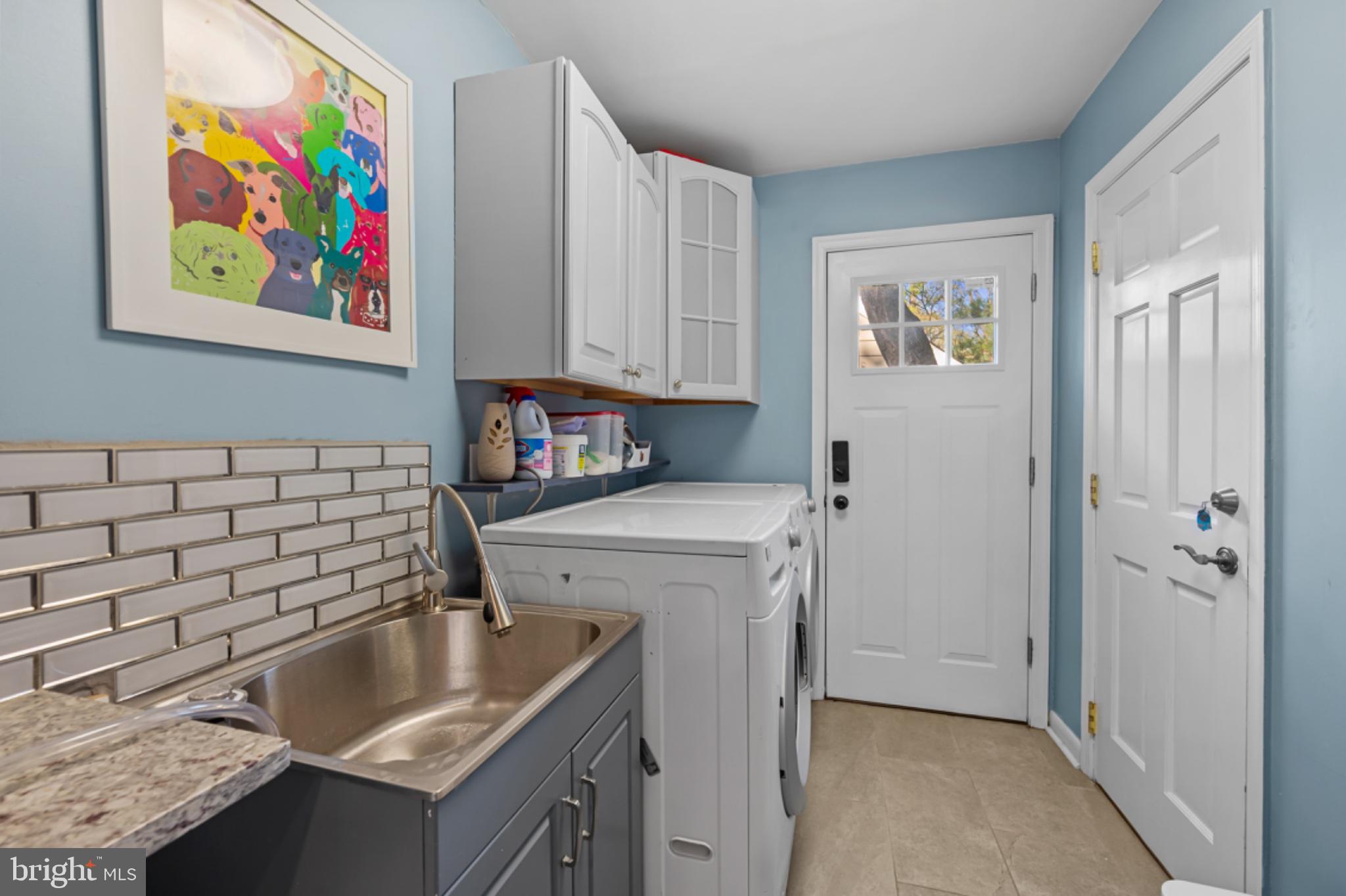 1001 Robin Road Silver Spring, MD 20901 - Photo 16 of 46 Bright and functional laundry space.