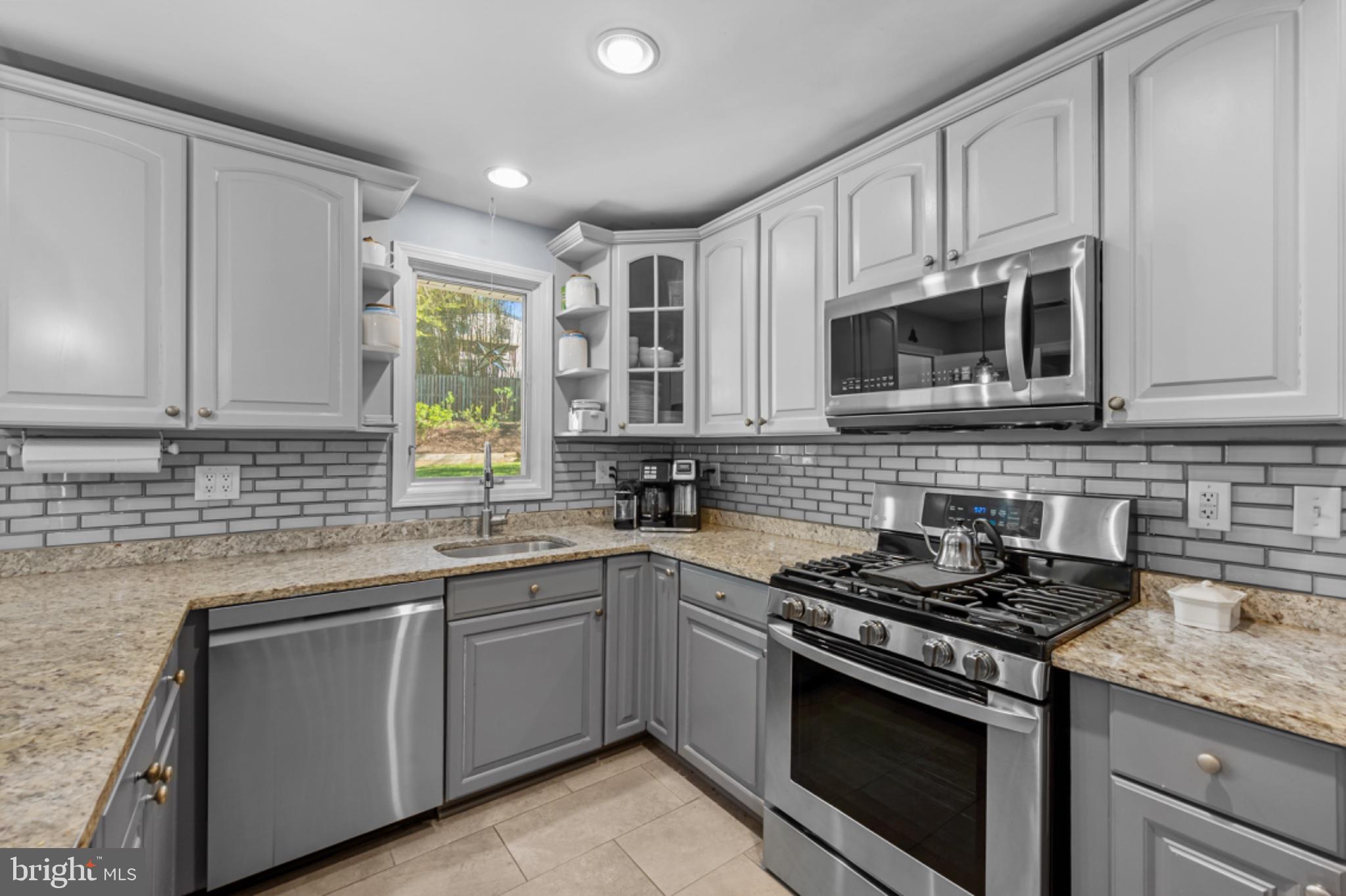 1001 Robin Road Silver Spring, MD 20901 - Photo 10 of 46 Modern kitchen with sleek finishes.