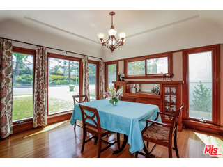 1555 Campus Road Los Angeles, CA 90042 - Photo 11 of 35 a view of a dining room with furniture a chandelier and wooden floor