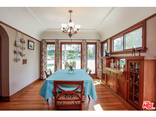1555 Campus Road Los Angeles, CA 90042 - Photo 12 of 35 a view of a dining room with furniture a chandelier and wooden floor