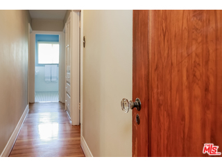 1555 Campus Road Los Angeles, CA 90042 - Photo 19 of 35 a view of a bathroom with a wooden door