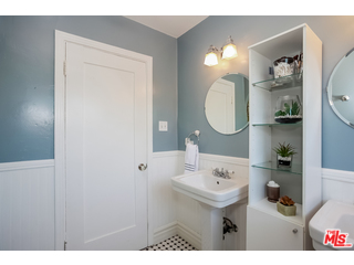 1555 Campus Road Los Angeles, CA 90042 - Photo 23 of 35 a bathroom with a sink vanity mirror and a toilet