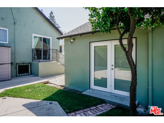 1555 Campus Road Los Angeles, CA 90042 - Photo 29 of 35 a view of house with backyard and glass door