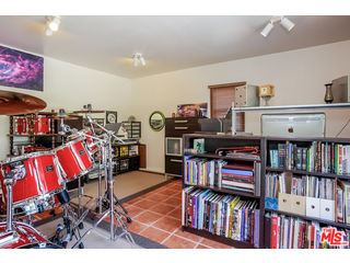 1555 Campus Road Los Angeles, CA 90042 - Photo 32 of 35 a living room with lots of books and a book shelf