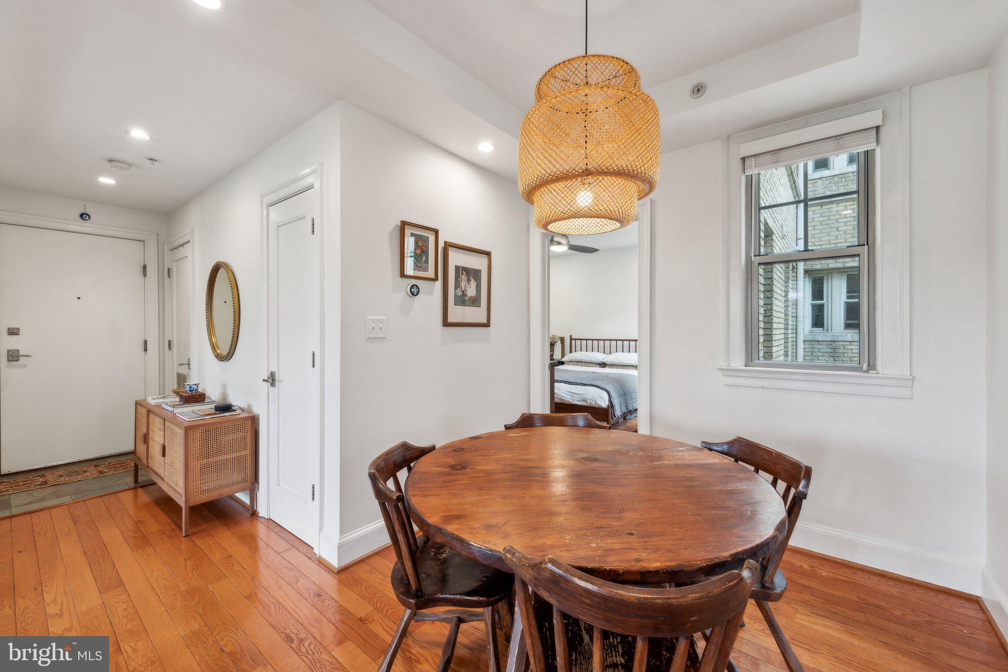 3220 17th Street Northwest, Unit 309 Washington, DC 20010 - Photo 11 of 25 a view of a dining room with furniture and wooden floor