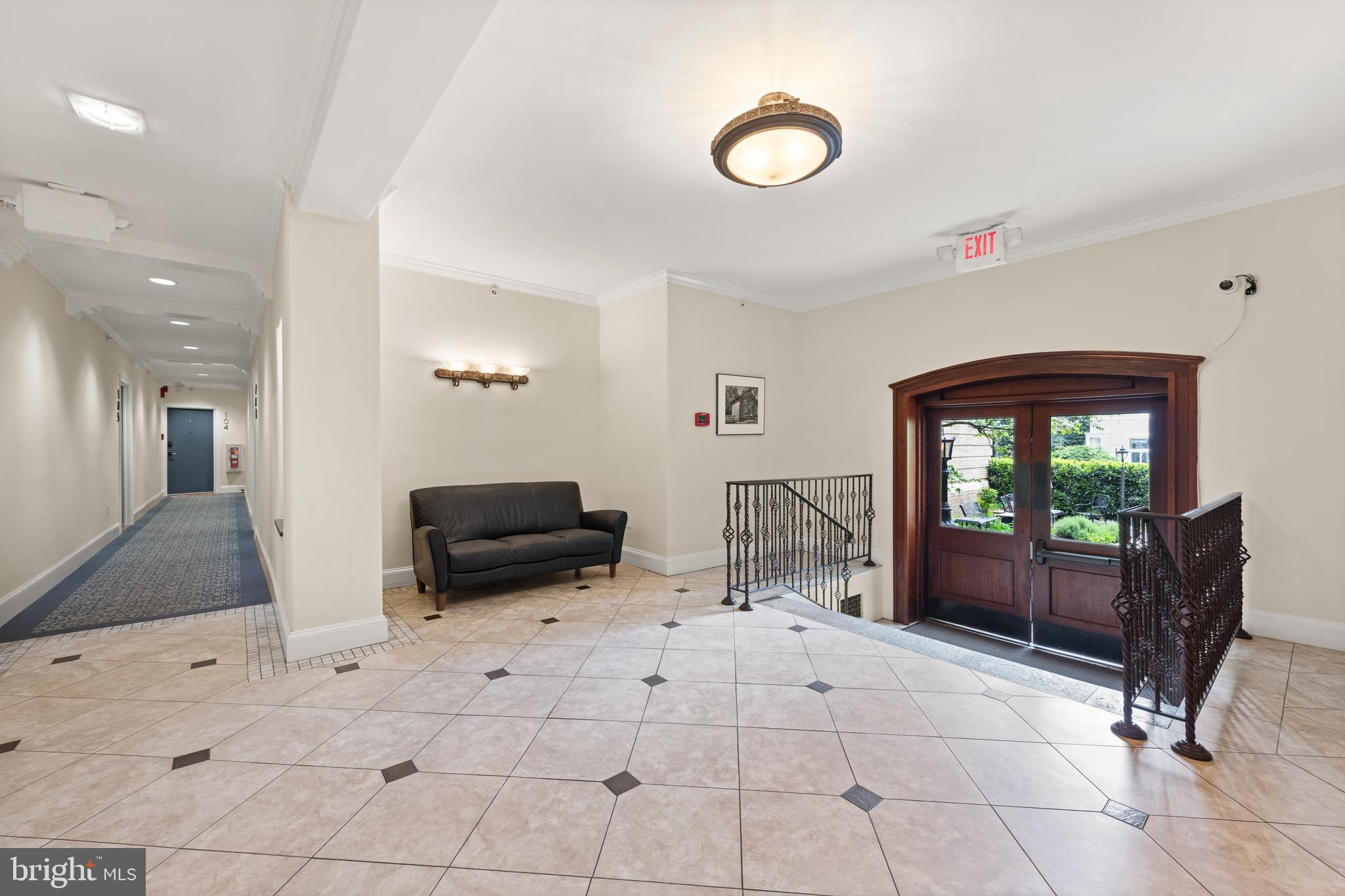 3220 17th Street Northwest, Unit 309 Washington, DC 20010 - Photo 24 of 25 a living room with furniture and a flat screen tv