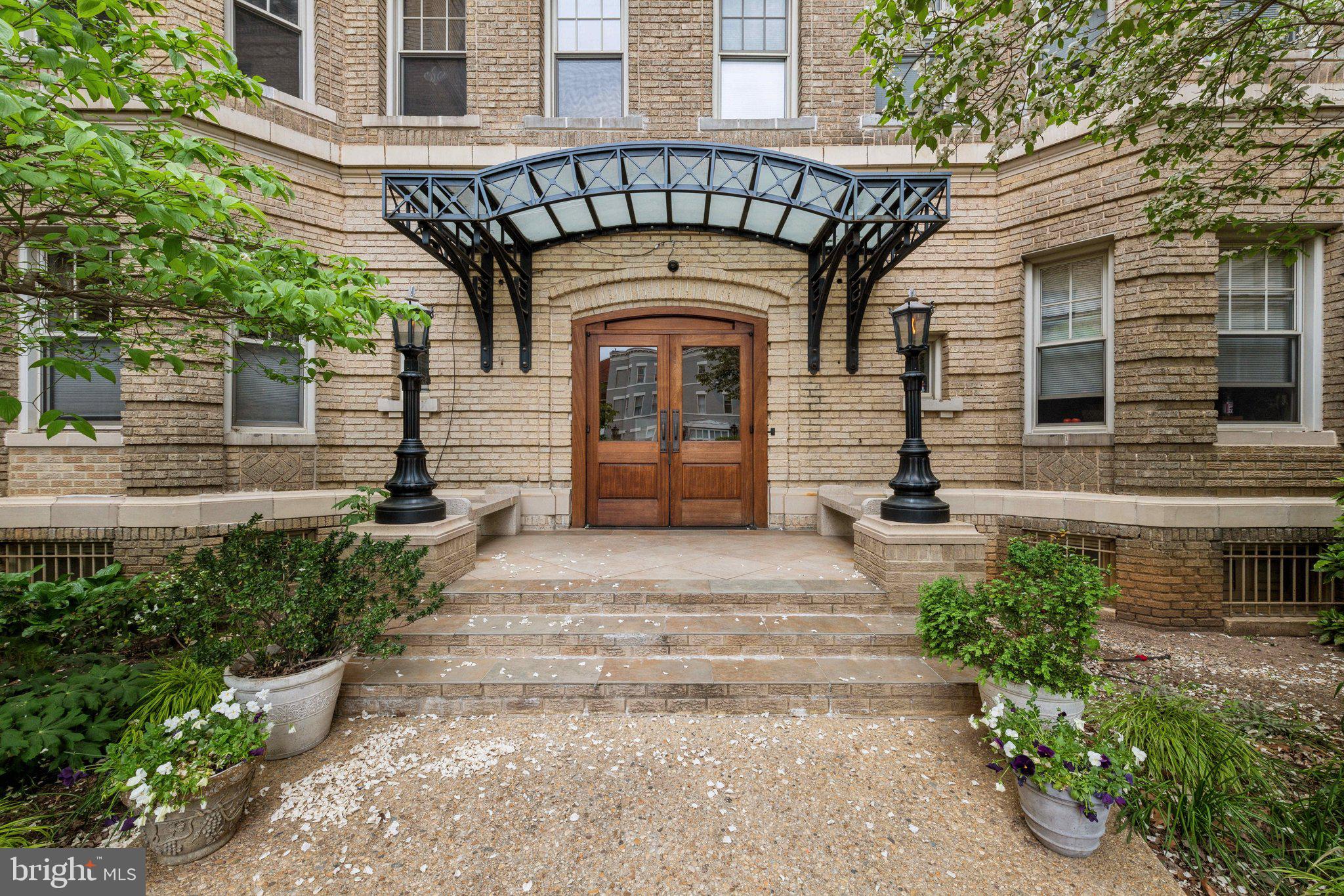 3220 17th Street Northwest, Unit 309 Washington, DC 20010 - Photo 5 of 25 a view of a brick house with large windows
