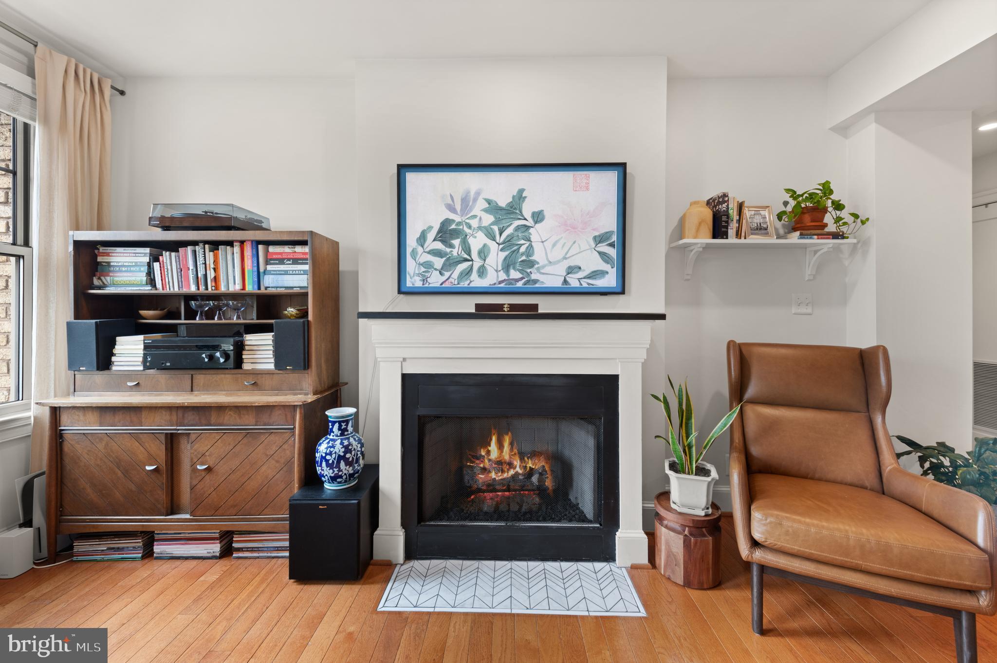 3220 17th Street Northwest, Unit 309 Washington, DC 20010 - Photo 10 of 25 a living room with furniture and a fireplace