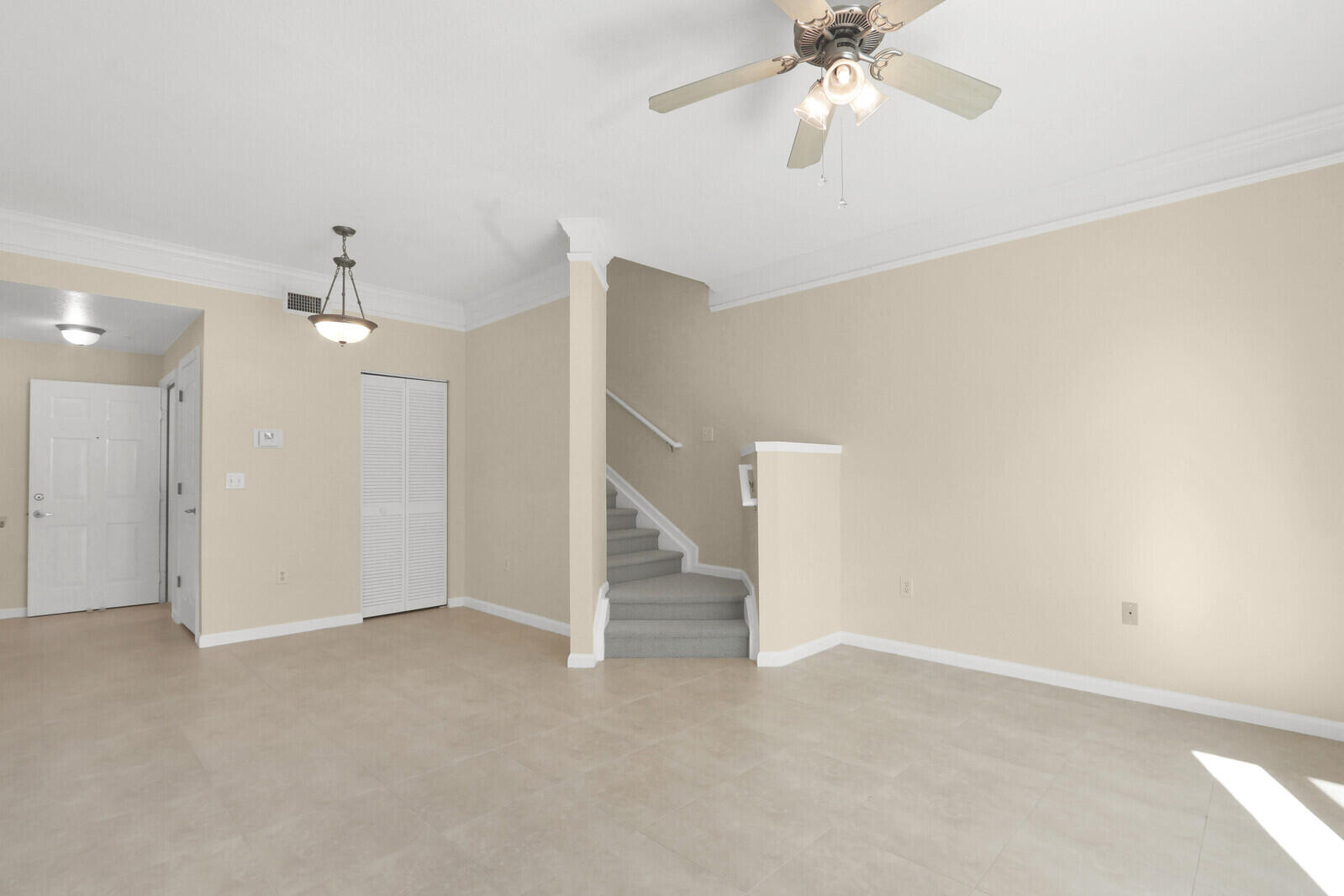 255 Murcia Drive, Unit 202 Jupiter, FL 33458 - Photo 23 of 63 a view of an empty room and chandelier fan