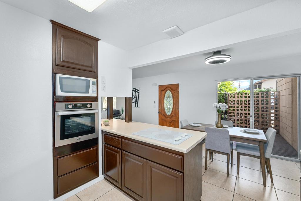 514 Shady Lane, Unit C El Cajon, CA 92021 - Photo 15 of 30 a room that has a bed and a table in it