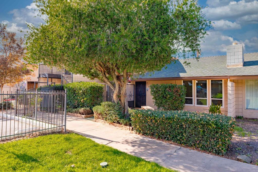 514 Shady Lane, Unit C El Cajon, CA 92021 - Photo 3 of 32 a view of a house with a small yard and plants