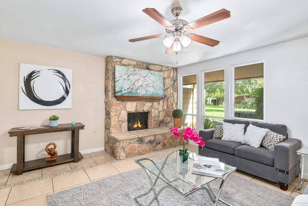 514 Shady Lane, Unit C El Cajon, CA 92021 - Photo 7 of 30 a living room with furniture a chandelier and a fireplace