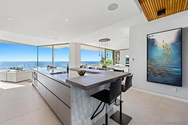a large kitchen with a large counter top appliances and cabinets