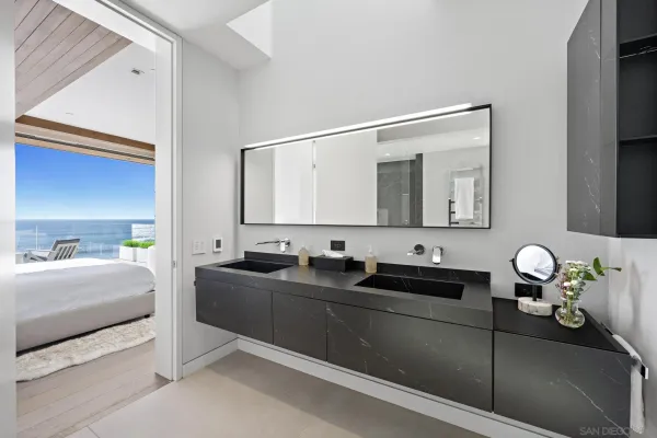 a living room with a balcony a bed and a couch