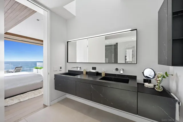 a living room with a balcony a bed and a couch