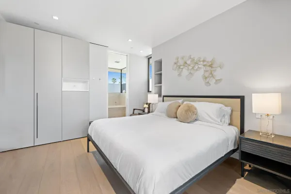 a room with a bed and a view of balcony