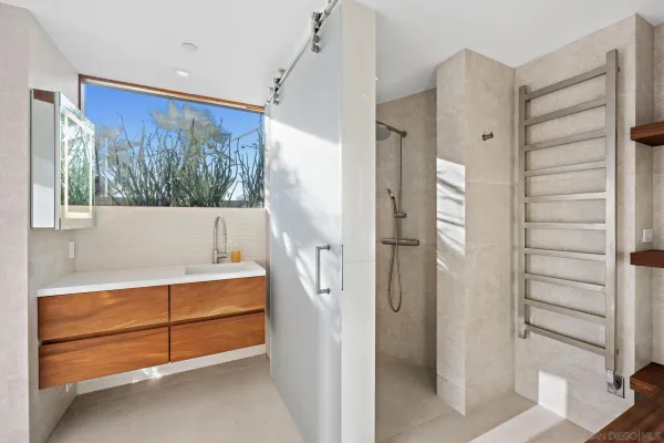 a bathroom with a bathtub and a shower