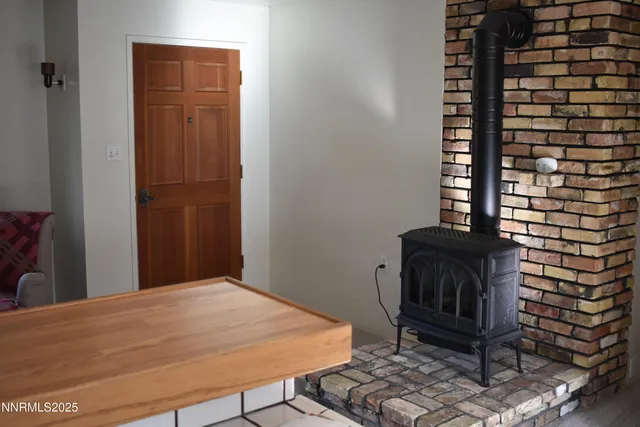 a bedroom with a bed and a chair