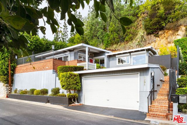 front view of a house with a street