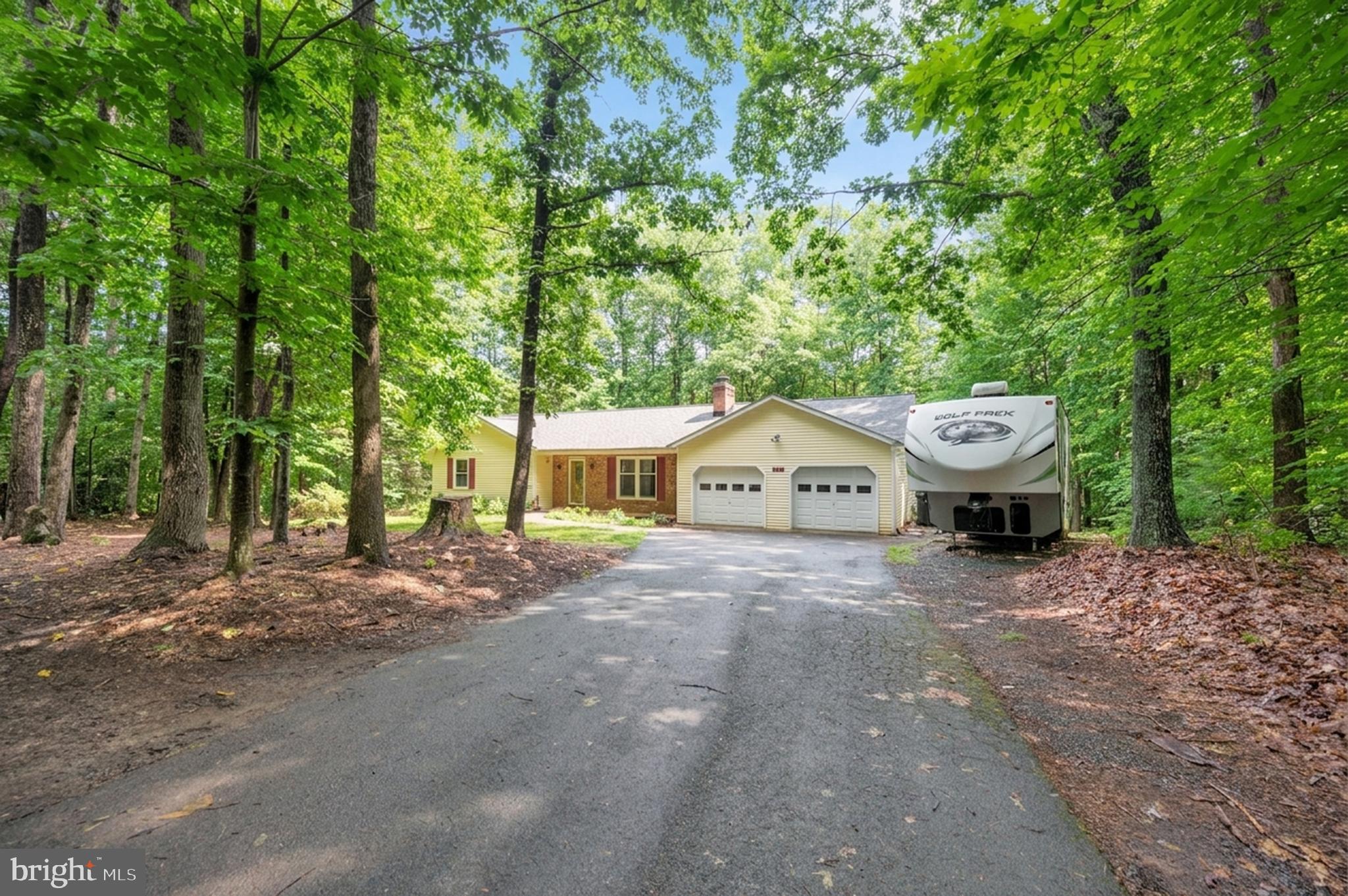 679 Cropp Road Fredericksburg, VA 22406 - Photo 3 of 39 a view of a house with a yard and tree s