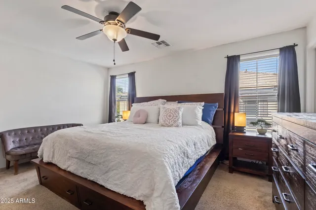 a view of a hallway with paintings on the wall