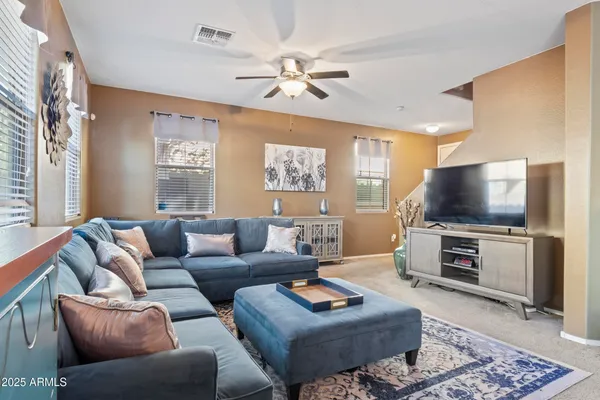 a living room with furniture and a large window