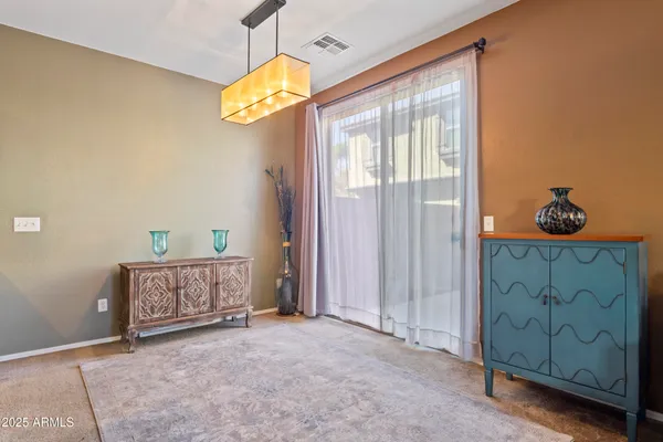 a living room with furniture windows and a flat screen tv
