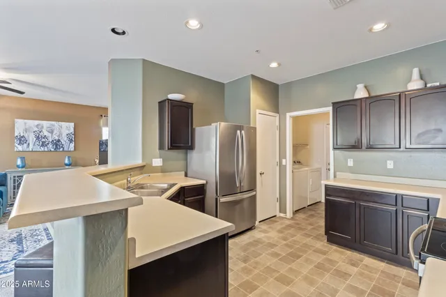 a kitchen with a sink a stove and refrigerator