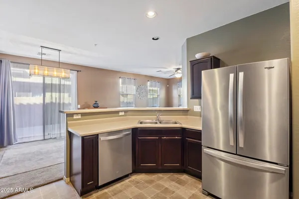 a kitchen that has a sink and a stove in it