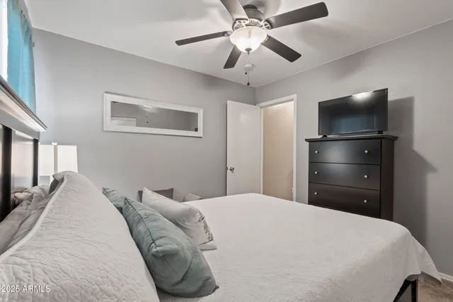 a bedroom with a bed and window