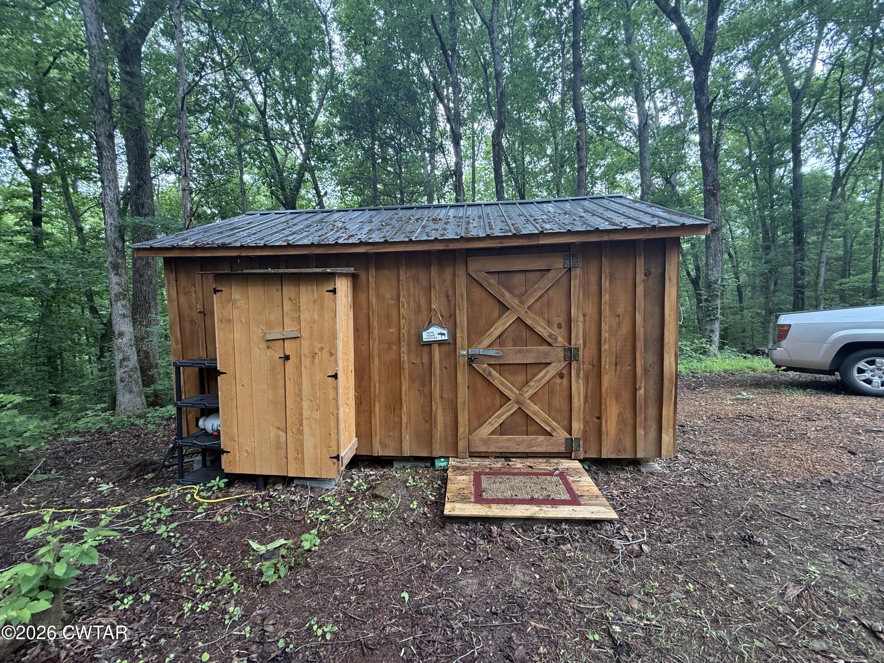 1782 Smith Chapel Road Decaturville, TN 38329 - Photo 2 of 22 a view of backyard with wooden fence