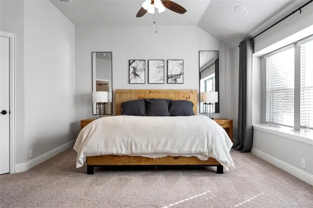 a bedroom with a bed and window