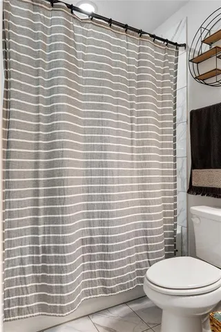 a bathroom with a toilet and a sink