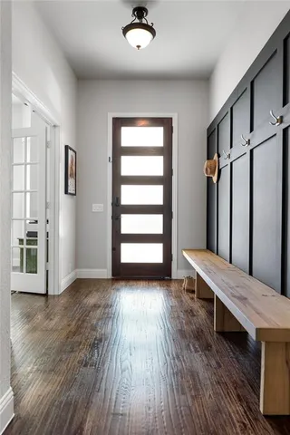 a view of wooden floor and windows in a room