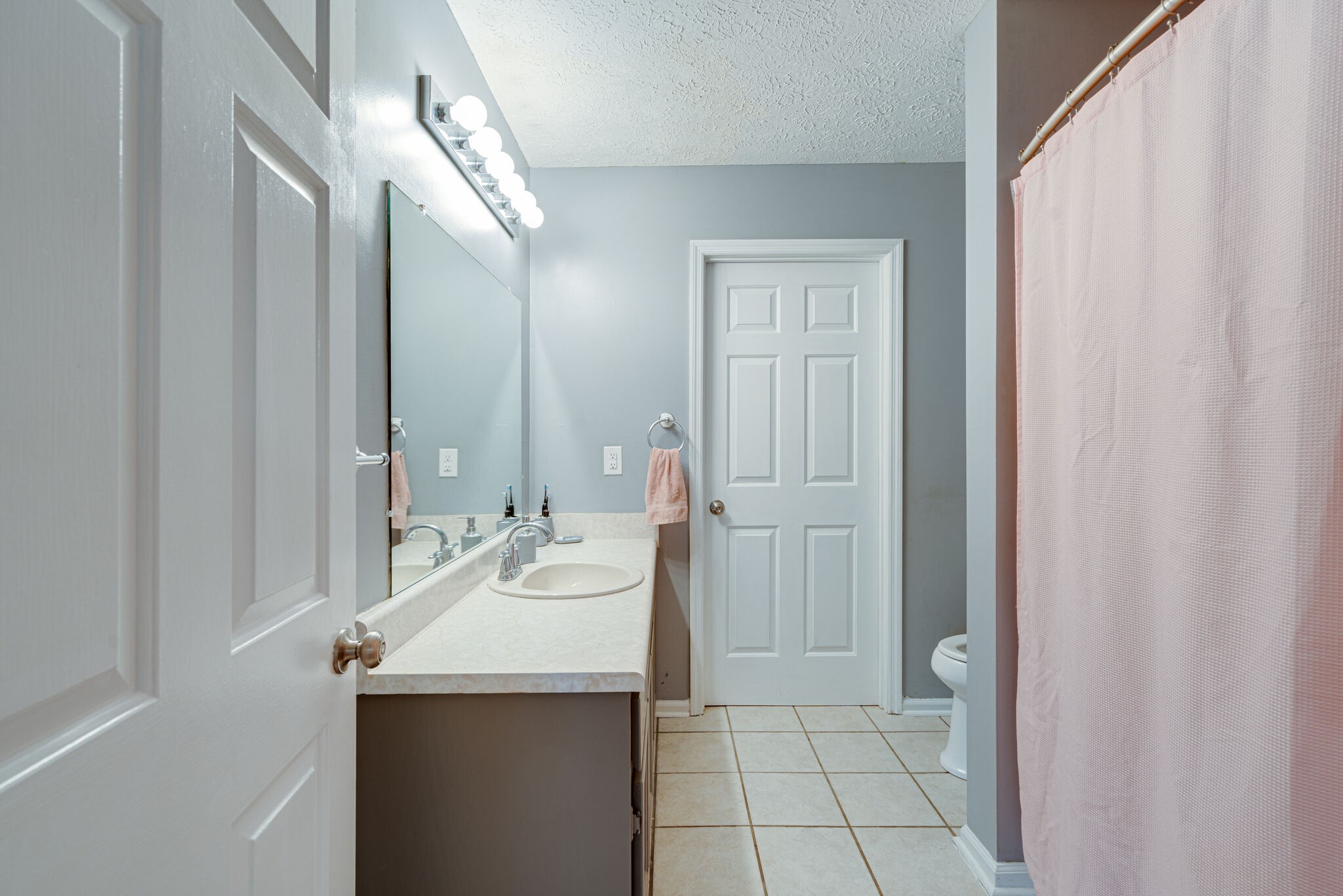 1453 Ocoee Trail Madison, TN 37115 - Photo 17 of 25 a bathroom with a sink and a mirror