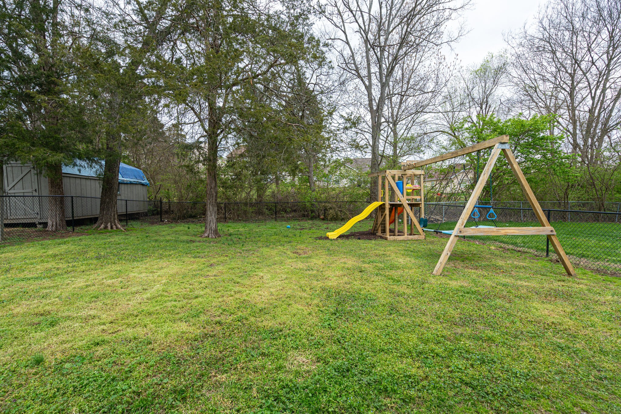 1453 Ocoee Trail Madison, TN 37115 - Photo 25 of 25 a view of a yard with a slide and a child swing